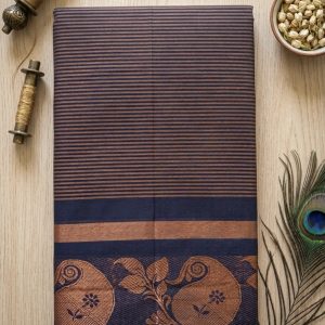 navy blue and copper cotton saree features horizontal stripes and a traditional paisley border