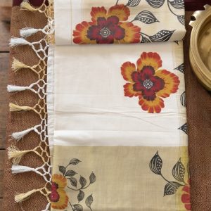 chithira kerala kasavu tissue cotton saree featuring a floral print design